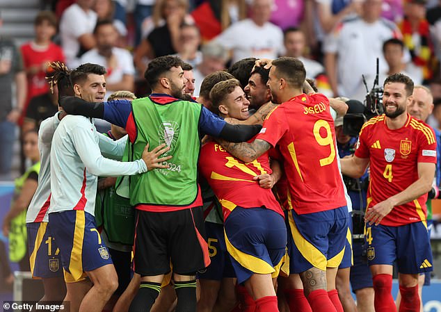 Spain players turned out to celebrate with Merino after he secured his place in the semi-finals