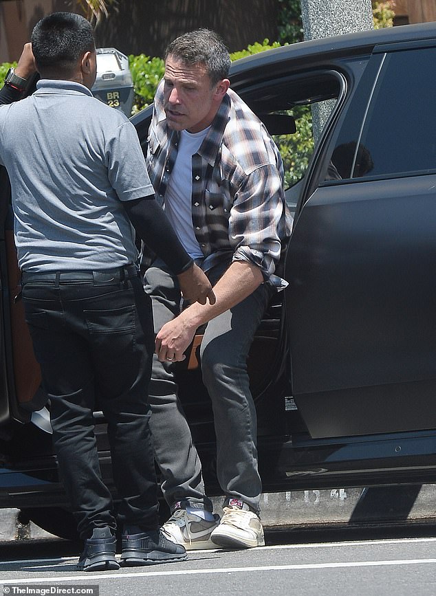 Ben showed off his wedding ring as he headed out to lunch alone.