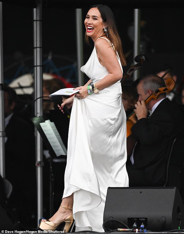 Myleene paired the turtleneck dress with gold platform heels and hiked up her dress as she walked across the stage.