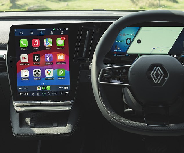 The cloth-covered instrument panel has a 12-inch multimedia screen and a 12.3-inch driver display.