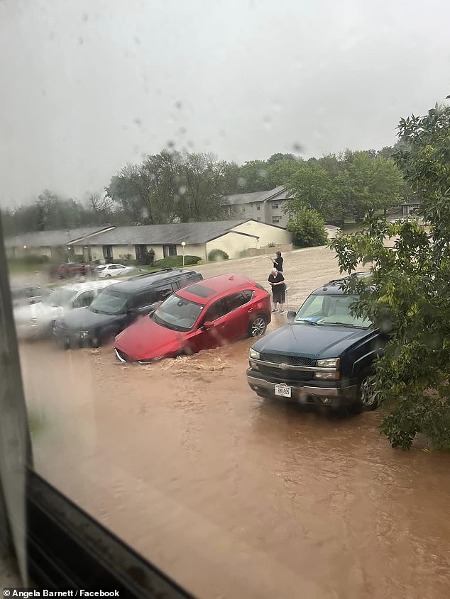 Several streets in the area have been flooded and several cars are stranded on the road.