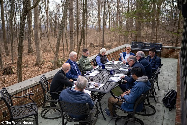 Biden likes to do prep work at Camp David: Above, he and his team prepare for the State of the Union address at Camp David in March.