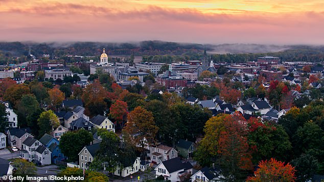 Aerial shots of the New Hampshire State House in Concord at sunrise on a foggy morning