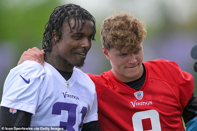 Jackson is photographed with quarterback and fellow draftee JJ McCarthy at rookie camp in May.