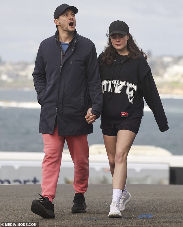 The Melbourne-based co-host, 33, and the actor, 42, held hands as they took a morning walk together in Sydney.