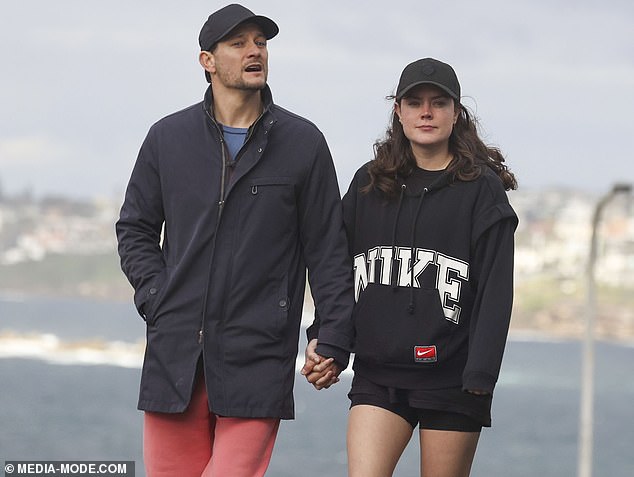 Georgie showed off her slender legs in tiny shorts and a jumper as she walked alongside her boyfriend in Coogee.