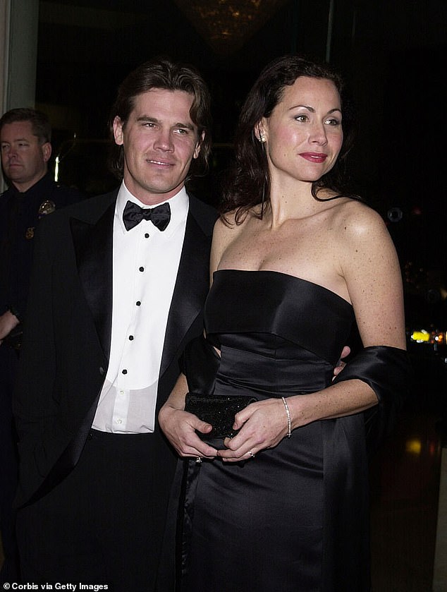 The couple got engaged in 2001, but the nuptials were called off just five months later; Josh and Minnie seen in 2001