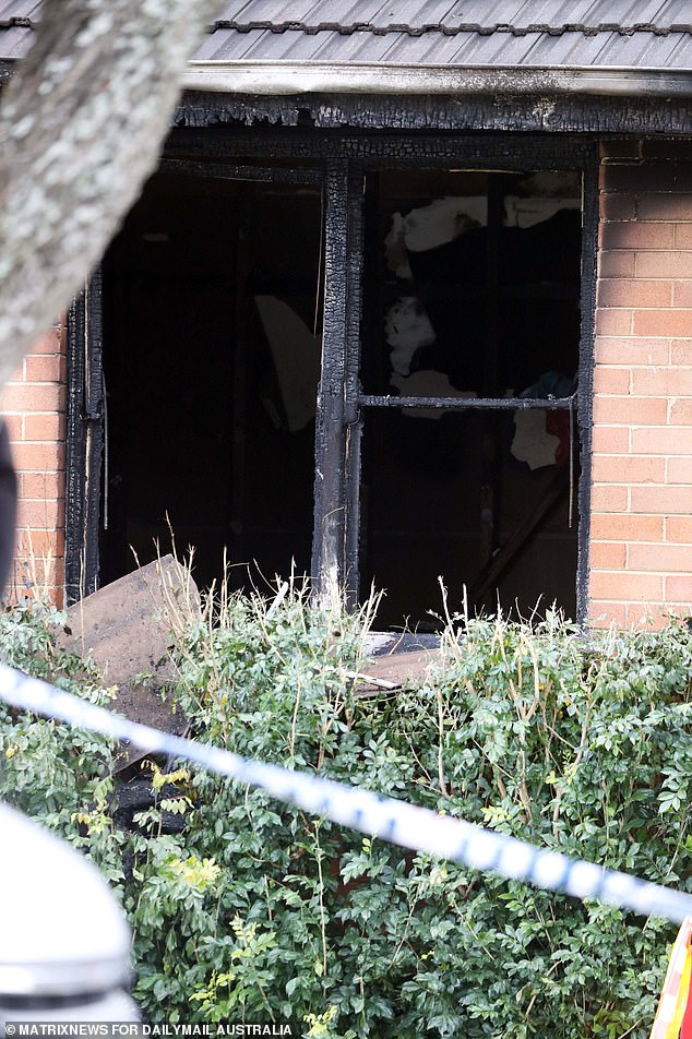 The fire razed the house, with bricks and window frames blackened and destroyed by flames that burst through the windows (pictured).