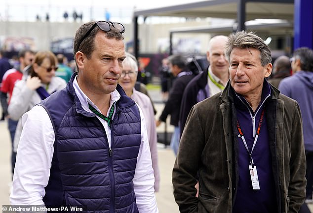 Princess Anne's son dressed for the temperamental British summer weather, pairing a lightweight button-down shirt with a waterproof vest and sunglasses.