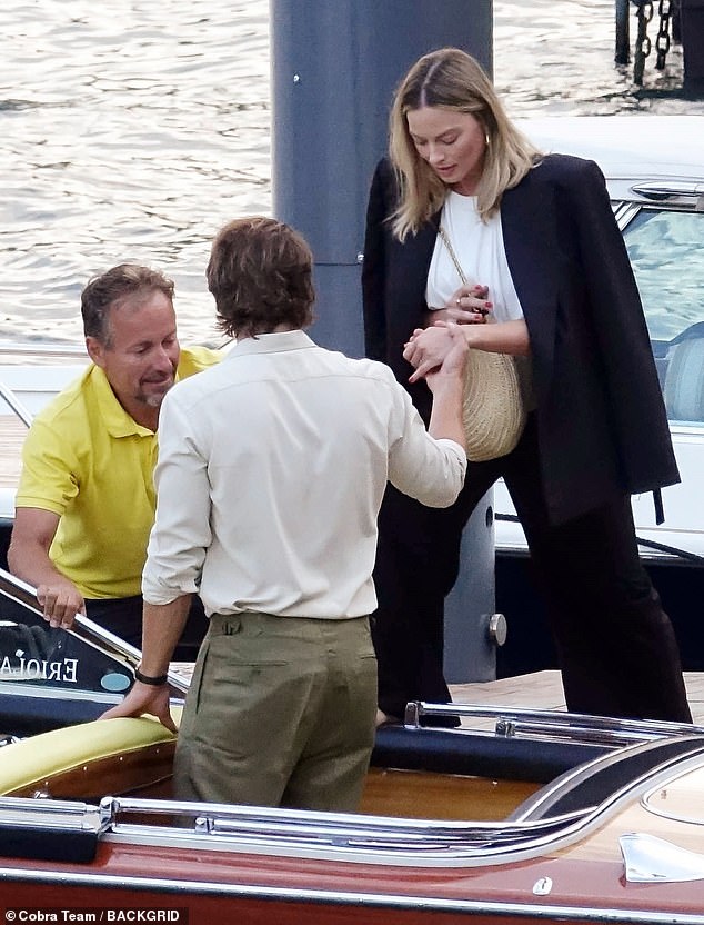 She watched with total concentration as he stepped into the boat.