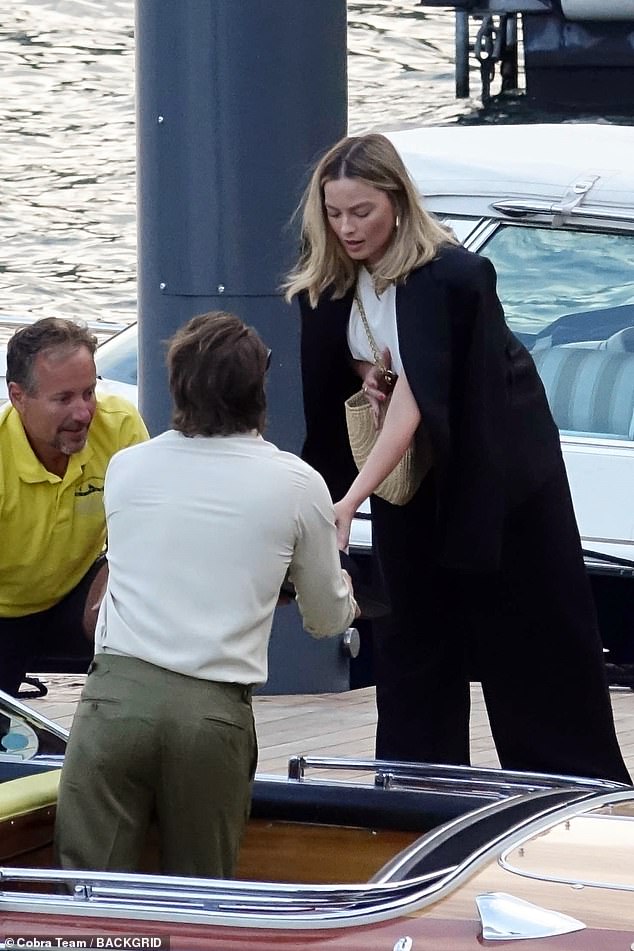 Tom gently helped her down into the boat.