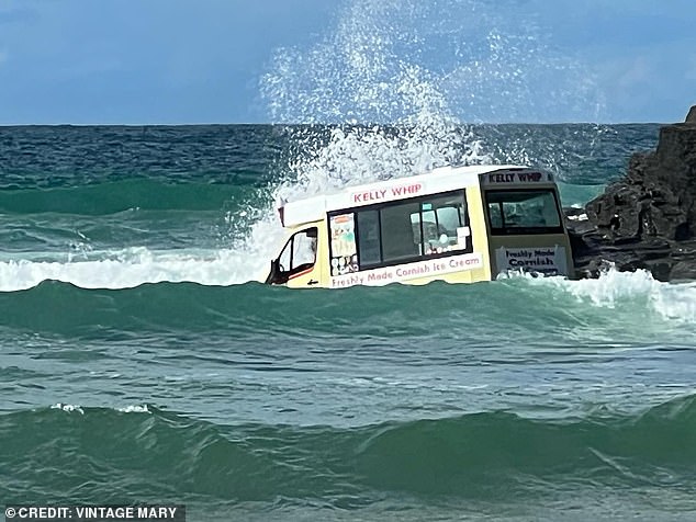 The Kelly Whip pickup truck was seen floating in the water as waves dramatically crashed against it.