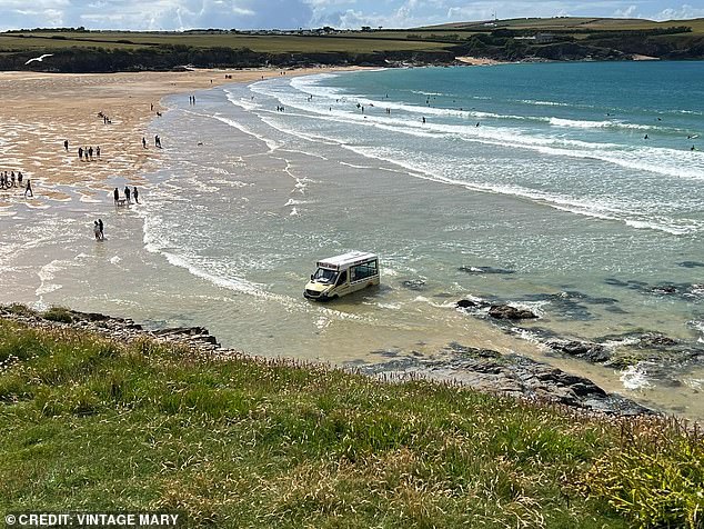 Bathers watched as the high tide swept away the ice cream truck.