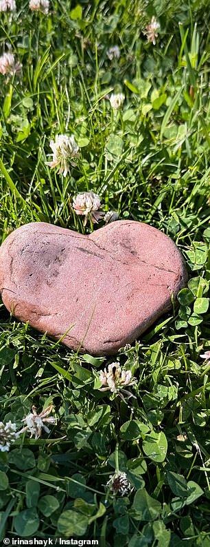 The model found a red rock shaped like a heart.