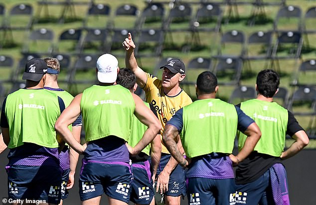 Ryles (pictured centre, looking at the camera while with the Storm) learned his coaching trade under renowned championship winner Craig Bellamy in Melbourne.