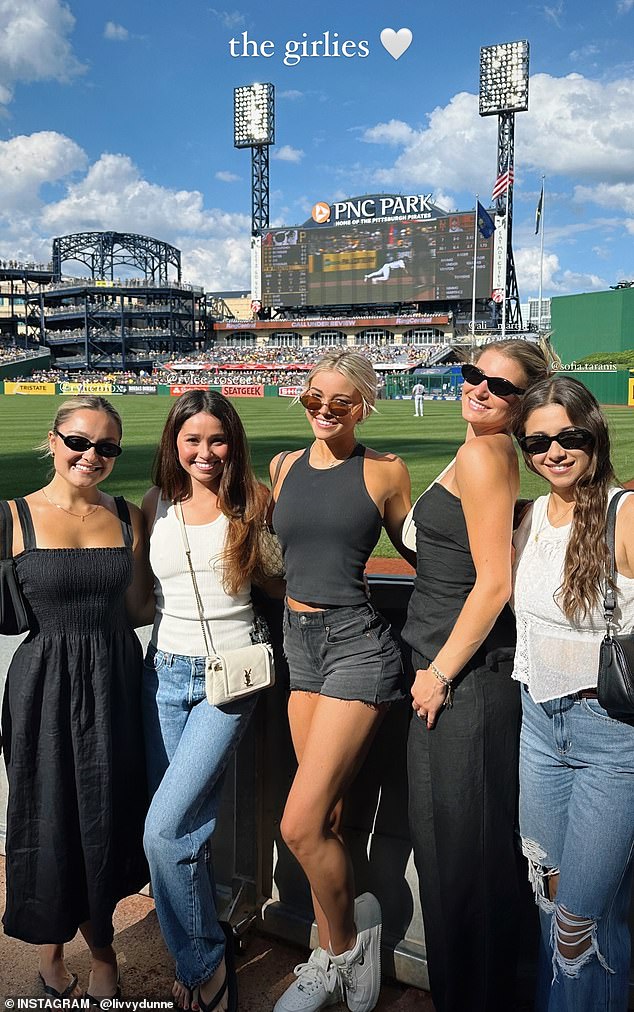 Dunne poses with her fellow Pittsburgh Pirates WAGs at PNC Park on Saturday afternoon.