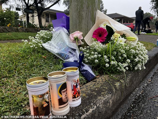 Neighbors and family friends left wreaths for the three children who died Sunday.