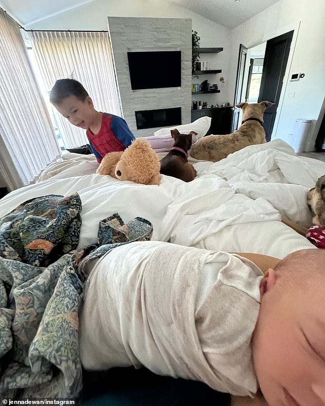 Another photo shows her four-year-old son Callum hanging out in bed with his little sister, mother and the family dogs.