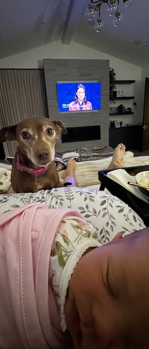 Another shows one of the dogs calmly watching over the little boy, who is wrapped in a pink blanket and lying on his mother's lap, as the adults enjoyed breakfast in bed. Dewan shares Rhiannon and Callum with her fiancé Steve Kazee