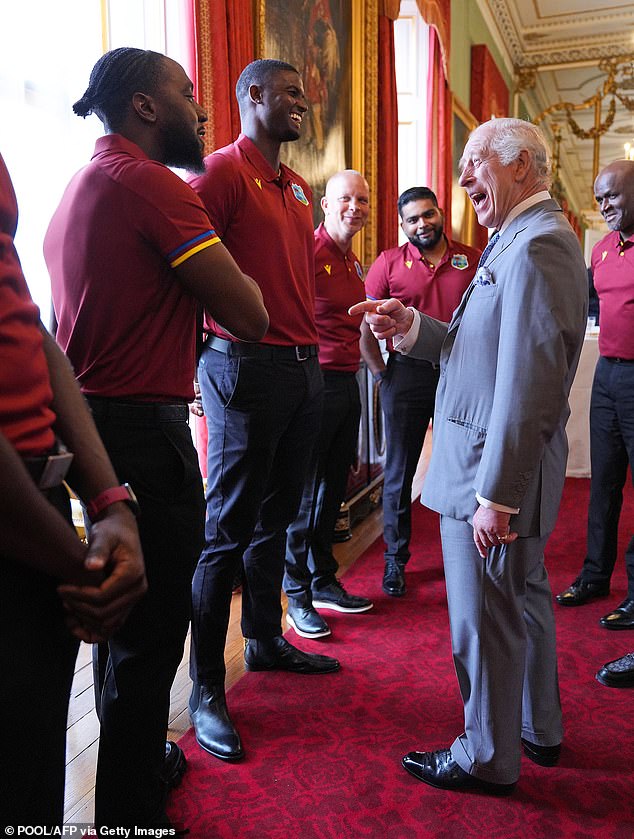 Charles seemed to enjoy quiet moments with the team, sharing laughs and learning to shake hands.