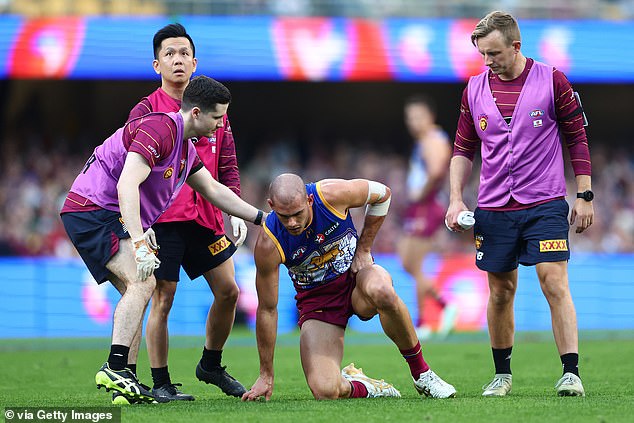 Starcevich struggles to his feet after Rankine's hit, which could cost both players time on the court.