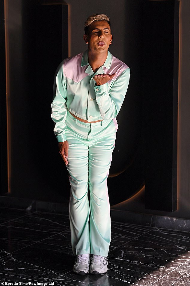 Junaid Ahmed, 28, also attended the exclusive club wearing a mint and baby pink trouser set.