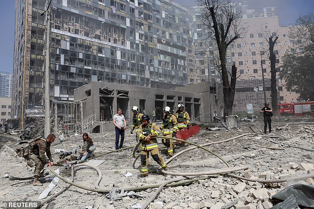 Rescuers work at the site of a building damaged during a Russian missile attack, amid Russia's attack on Ukraine, in kyiv, Ukraine, July 8, 2024.