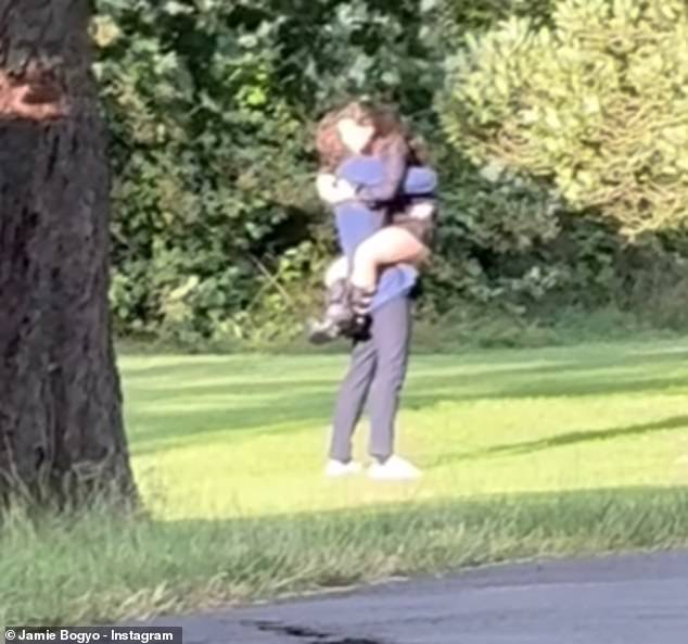 In Jamie's post, Marisa can be seen jumping into her partner's arms after he got down on one knee in the park to give her a sweet hug.