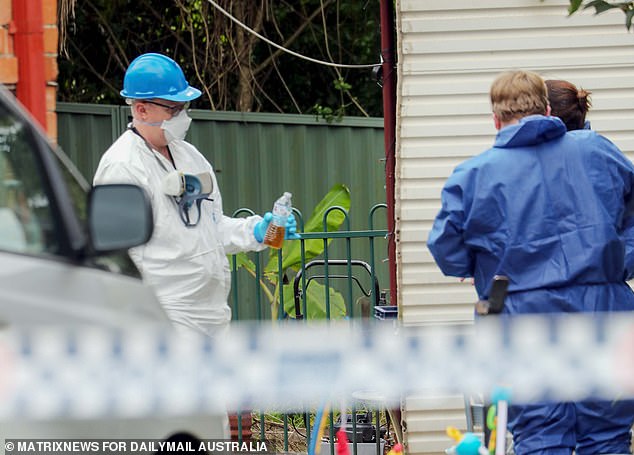 Among the evidence removed from the house were two water bottles containing a tea-like liquid.