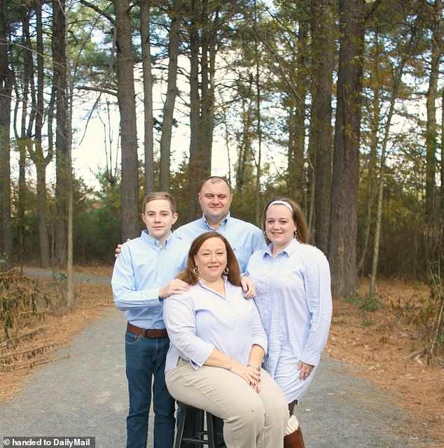 Shannon poses for a photo shoot in the woods with her wife Tresa, son Josh and stepdaughter Brittany.