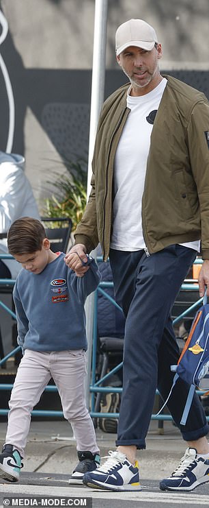 Hackett held his son Eddie's hand.