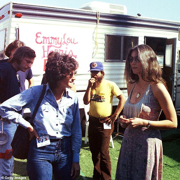 Martin is seen talking to singer-songwriter Emmylou Harris before a show in Los Angeles in 1975, when she was working as a manager and personal advisor for Warner Bros.