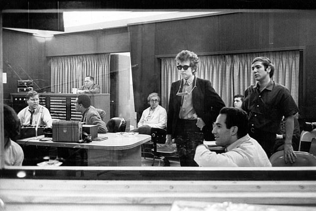 His most famous performance in the music world was introducing Bob Dylan to the Hawks, who would later become The Band. The folk icon is pictured here with Martin's former boss Albert Grossman in 1965 during work on Highway 61 Revisited