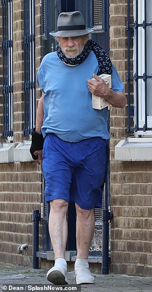 Sir Ian kept a low profile in casual blue shorts and a T-shirt with a hat over his famous face.