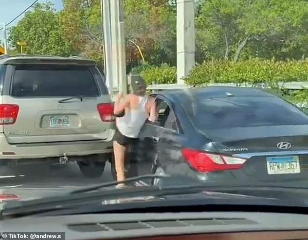 Their expletive-laden exchange escalates when the woman gets out of her car and appears to have forgotten to engage the handbrake, causing it to roll into a parked car.