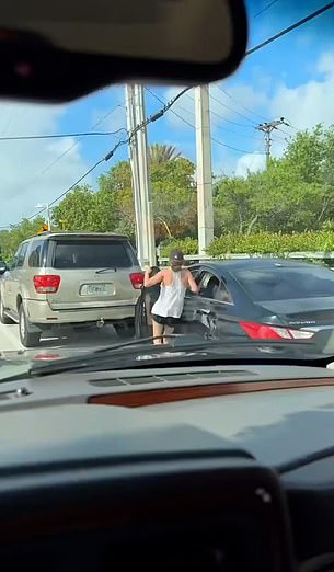 She chases after the vehicle and attempts to get back inside through the front door, but it closes and her leg becomes trapped between the door and a parked van.