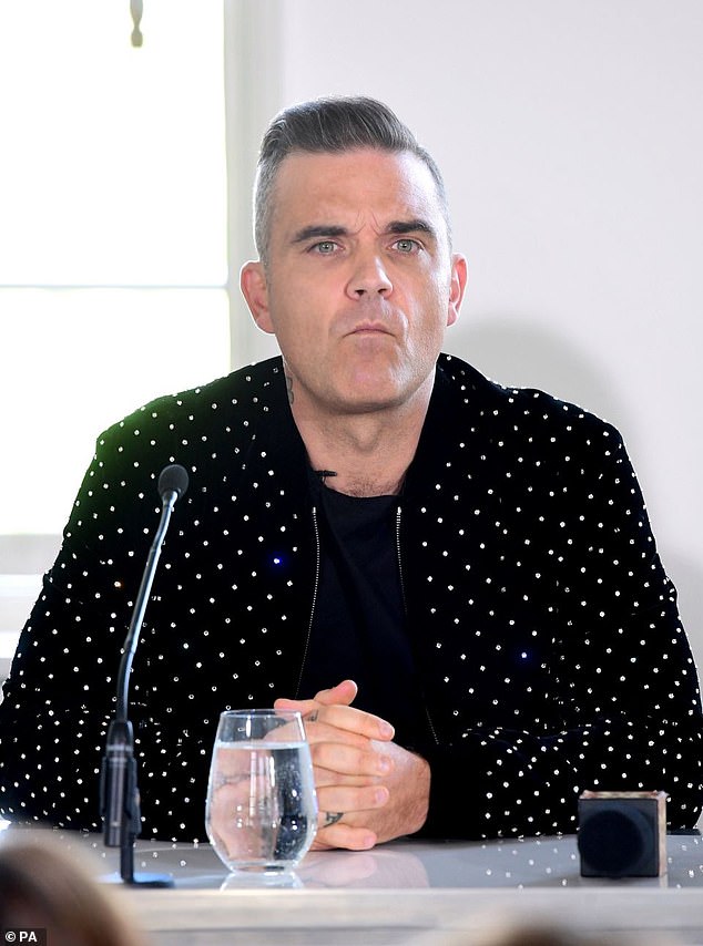 In 2022, Robbie reflected on his turbulent relationship with Oasis, calling them 