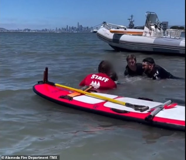 It happened near the Encinal boat ramp in Alameda on June 26, and the clip shows the young man almost completely submerged when officers arrived.