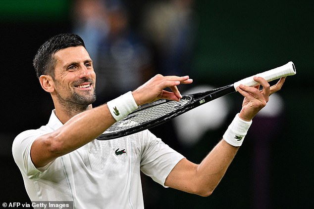 Novak Djokovic pretends to play the violin for his daughter as he celebrates his win over Denmark's Holger Rune