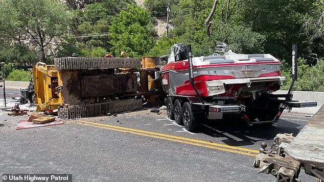 A crane carrying an excavator was coming in the opposite direction along the narrow two-lane corridor when the machine overturned from behind and fell directly onto the SUV.