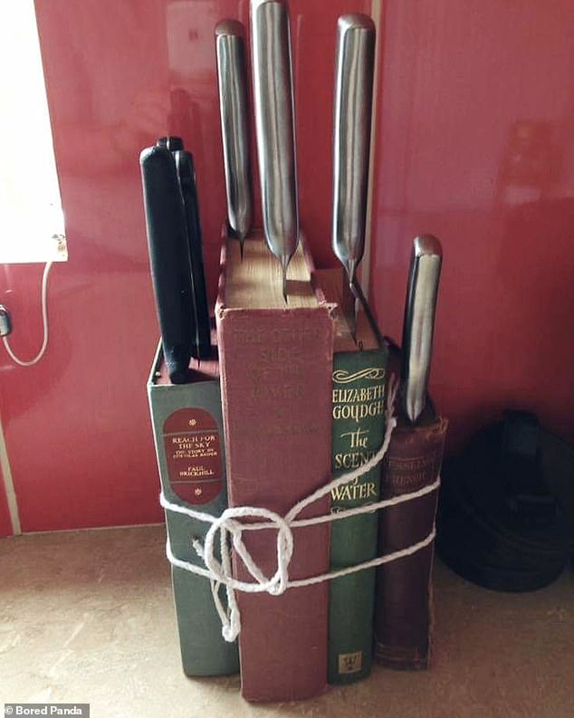 Confused! Another book lover decided to use some old books as a knife block in his kitchen.