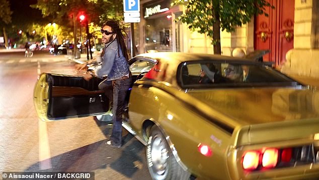 The 60-year-old rocker looked typically dapper in a double-denim ensemble as he stepped out of his gold car for a photo.