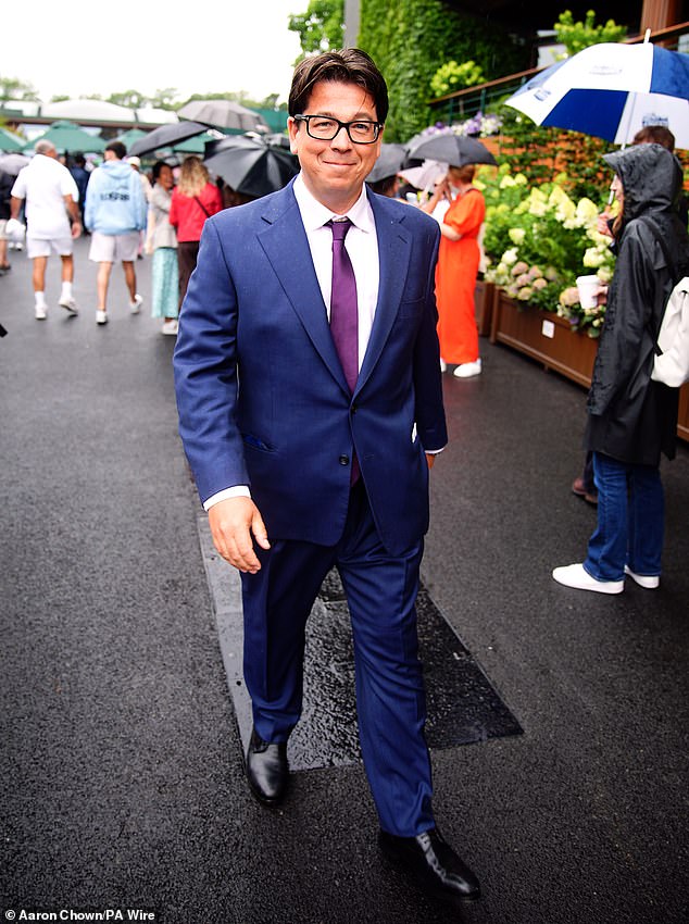 Michael McIntyre looked dapper in a navy suit and white shirt for the occasion.