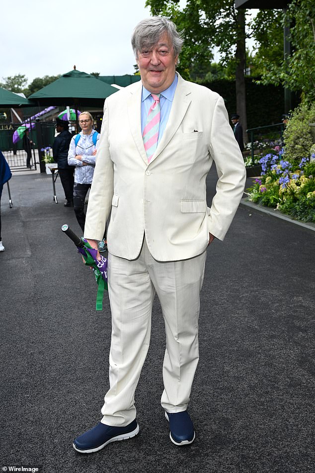 Stephen Fry looked dapper in a cream suit which he paired with a blue shirt and a blue and pink striped tie.