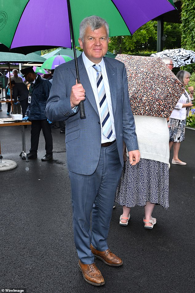 Adrian Chiles wore a blue-grey suit with a tonal blue tie.