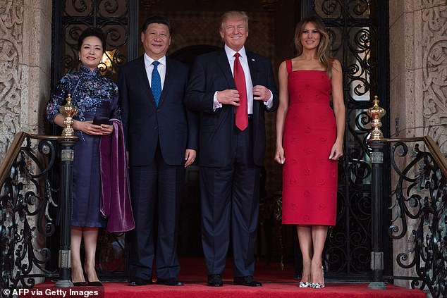 Melania once again wore a red Valentino dress she originally wore in April 2017 when she and then-President Trump hosted Chinese President Xi Jinping (second from left) and his wife Peng Liyuan (left) at Mar-a-Lago.