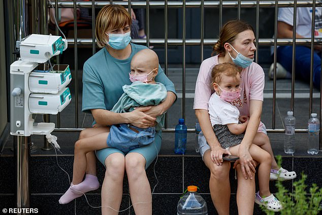 Young patients cradled after yesterday's missile attack in Ukraine