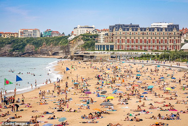 Grande Plage beach with the Hotel du Palais in the background. Winston Churchill, Pablo Picasso and Charlie Chaplin stayed here