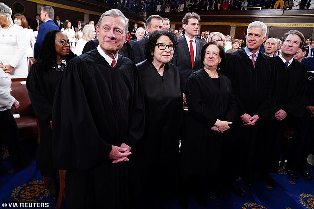 Chief Justice John Roberts, along with Associate Justices Sonia Sotomayor, Elena Kagan, Neil Gorsuch and Brett Kavanaugh, stand in the House Chamber ahead of U.S. President Joe Biden's third State of the Union address in March.