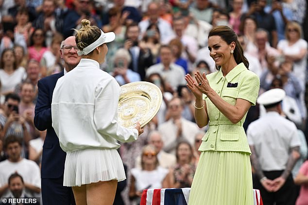 July 15, 2023: Marketa Vondrousova of the Czech Republic receives the trophy from the Princess of Wales after winning her women's singles final against Ons Jabeur of Tunisia.